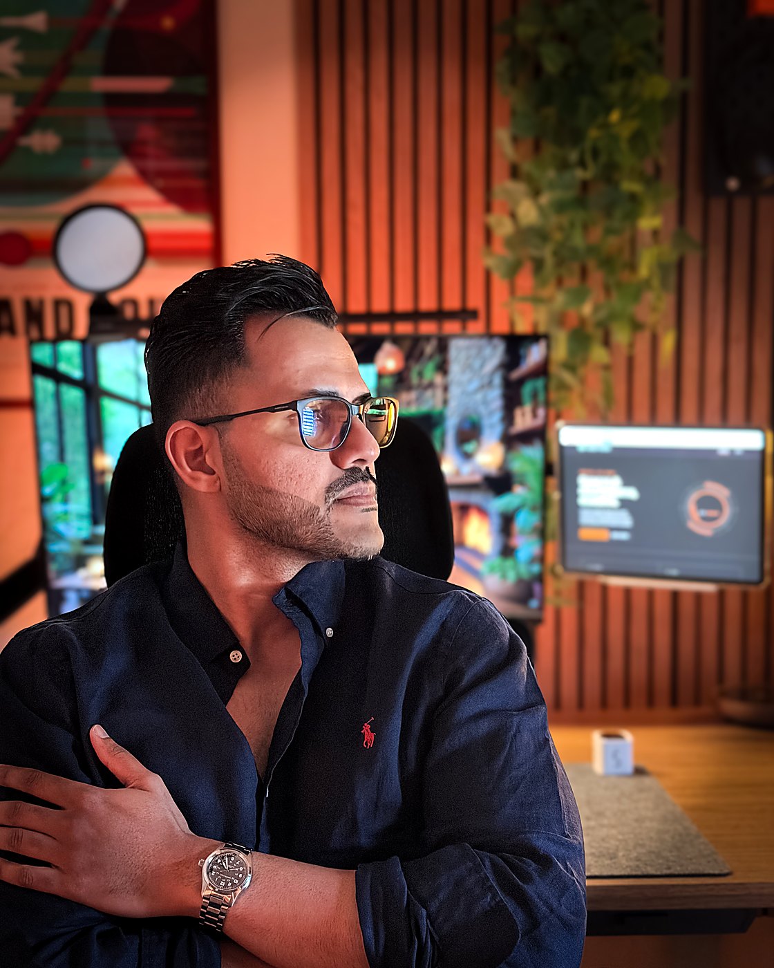 Abhinav at his desk, wearing a Hamilton Khaki Field watch