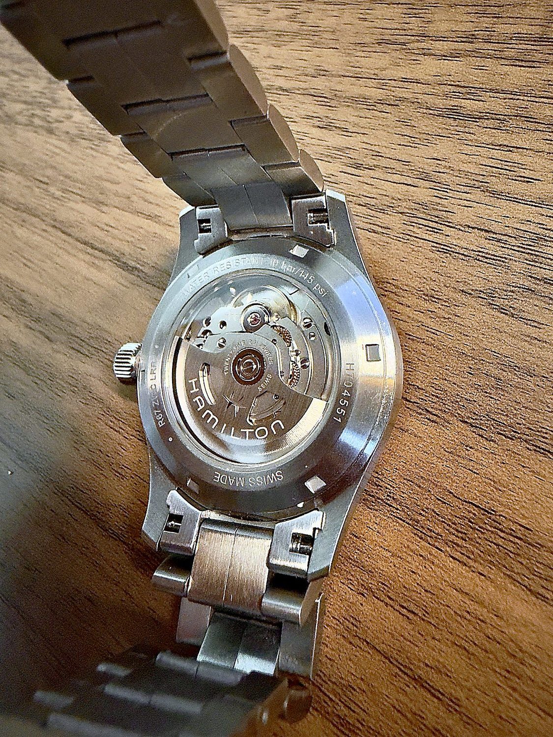 Exhibition caseback of the Hamilton Khaki Field Auto showing the H-10 movement, marked twenty-five jewels and Swiss made